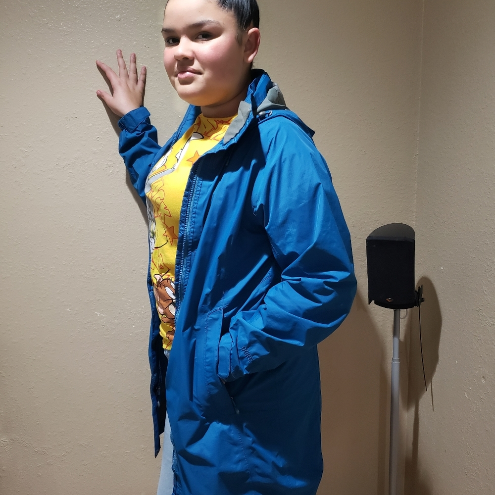 Gently used LL Bean rain jacket with detachable hood, color  turquoise.
